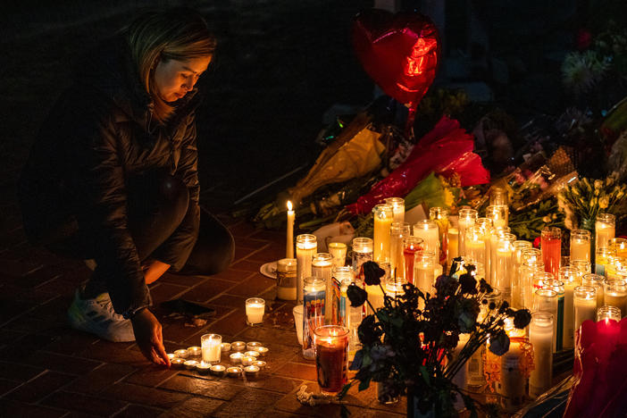 A new report from the U.S. Secret Service analyzes 173 mass attacks that took place in the country from 2016-2020. It comes just days after two shootings in California – in Monterey Park and Half Moon Bay – killed 18 people. Shown here is a mourner at a candlelight vigil for victims of the mass shooting at a dance studio in Monterey Park, Calif.