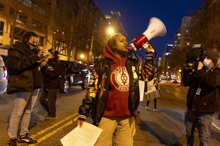Nikki Charles of the activist groups Harriet's Wildest Dreams and the D.C. Safety Squad block part of K Street in Washington D.C. to protest the police killing of Tyre Nichols.