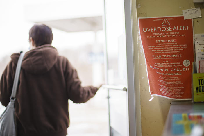 A sign calling attention to drug overdoses is posted in a gas station on the White Earth reservation in Ogema, Minn.. A new study shows that early deaths due to addiction and suicide have impacted American Indian and Alaska Native communities far more than white communities.