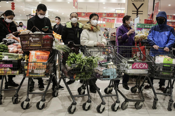 On Jan. 23, 2020, as the coronavirus spread in China, residents of Wuhan, where it was first identified, donned masks to go shopping. The U.S. didn't officially endorse masks as a preventive measure for the public for a number of weeks.