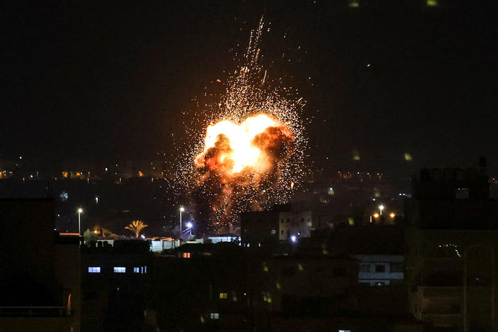 Fire and smoke rise above buildings in Gaza City as Israel launched airstrikes on the Palestinian enclave.