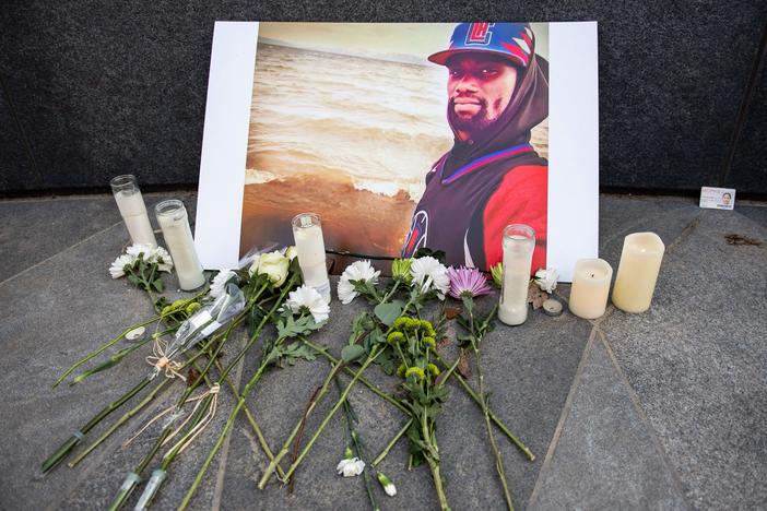 A memorial is displayed for Tyre Nichols at the Embrace statue in Boston, Massachusetts, on January 28, 2023.