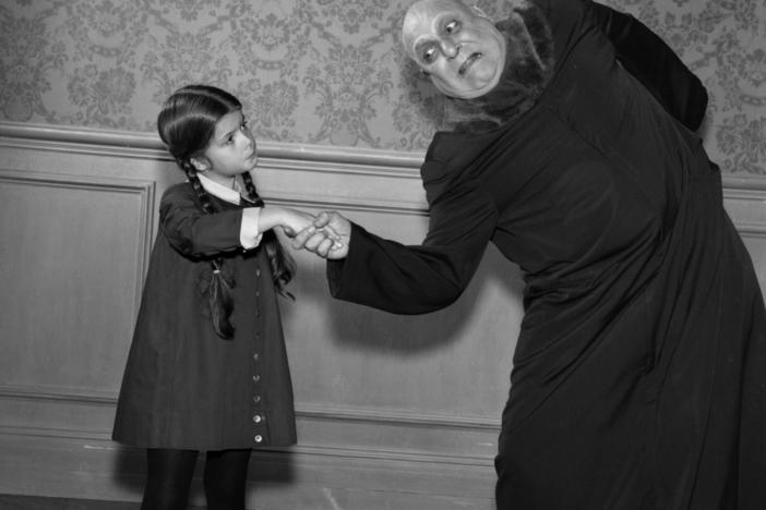 <em>The Addams Family</em> characters Wednesday and Uncle Fester. The actress who played the iconic Wednesday, Lisa Loring, died this weekend.