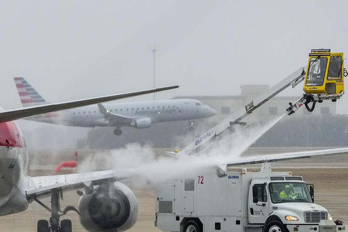 An American Airlines aircraft undergoes deicing procedures on Monday, Jan. 30, 2023, at Dallas/Fort Worth International Airport in Texas.
