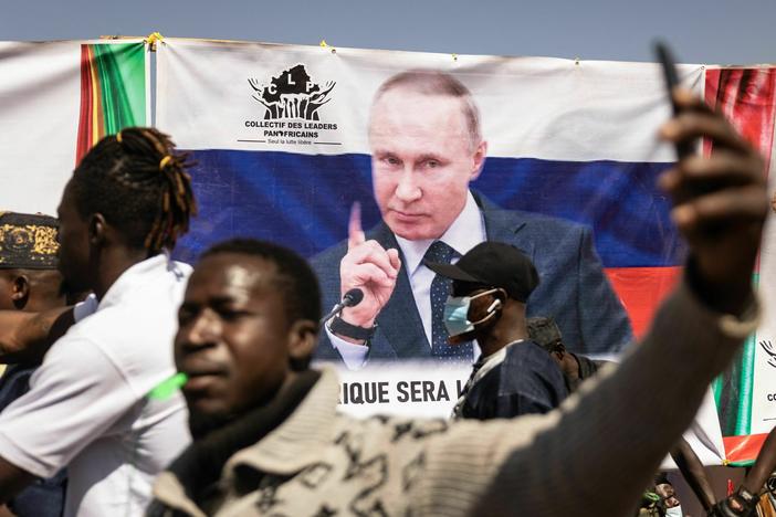 A banner of Russian President Vladimir Putin is seen during a protest to support the Burkina Faso President Captain Ibrahim Traore and to demand the departure of France's ambassador and military forces, in Ouagadougou, on Jan. 20, 2023. Russia has been trying to expand its influence throughout Africa in recent years.