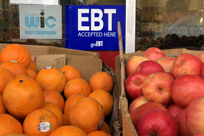 A sign noting the acceptance of electronic benefit transfer (EBT) cards, which SNAP beneficiaries use to pay for food, is displayed at a grocery store in 2019 in Oakland, Calif. SNAP emergency allotments are ending after this month and have already ended in some parts of the country.