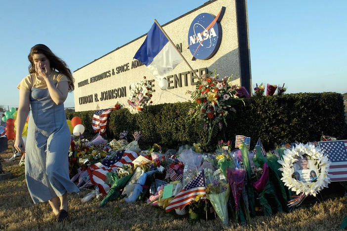 Mourners left a makeshift memorial outside NASA's Johnson Space Center in Houston after the Columbia disaster on Feb. 1, 2003.