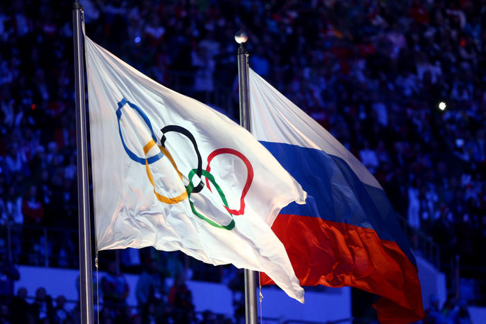 The Olympic flag and Russian flag seen during the Sochi Winter Olympics in 2014.