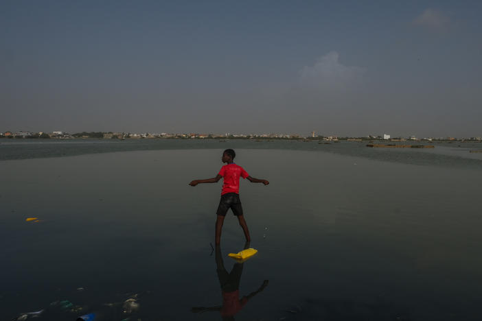 Guet N'dar, Senegal (October 7, 2022) - The neighborhood Khar Yalla, which means 'Waiting for God," in Wolof, was meant as a place for those who had been displaced by rising seas to live. But this neighborhood soon, too, was inundated with water.