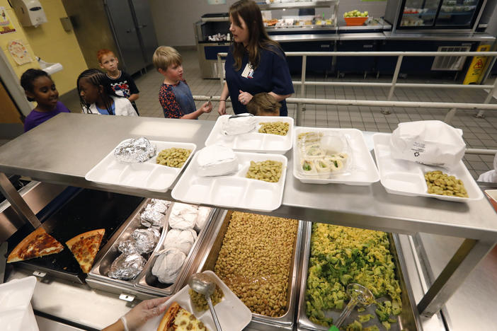 A teacher lines up the students for school-prepared lunches at Madison Crossing Elementary School in Canton, Miss. in 2019. The USDA unveiled new nutrition standards for school meals that would limit sugar and sodium.