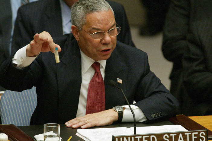Then-U.S. Secretary of State Colin Powell holds up a vial that he said was the size that could be used to hold anthrax as he addresses the United Nations Security Council in February 2003 at the U.N. in New York.