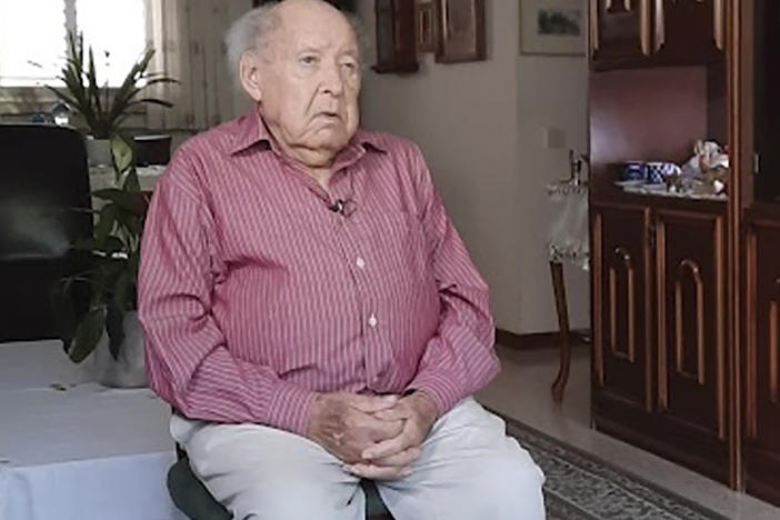This undated photo provided by Yad Vashem Holocaust Memorial shows Shlomo Perel at his home in Givatayim, Israel. Perel, who survived the Holocaust through surreal subterfuge and an extraordinary odyssey that inspired his own writing and an internationally renowned film, has died. He was 98.