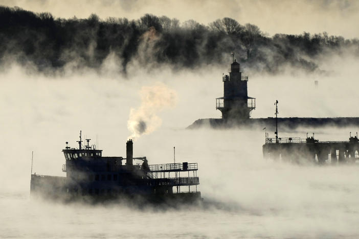 Arctic sea smoke rises from the the Atlantic Ocean as a passenger ferry passes Spring Point Ledge Light, on Saturday, off the coast of South Portland, Maine. The morning temperature was about minus 10 degrees Fahrenheit.