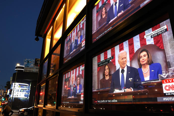 Televisions broadcast President Joe Biden as he delivers his State of the Union address last year.