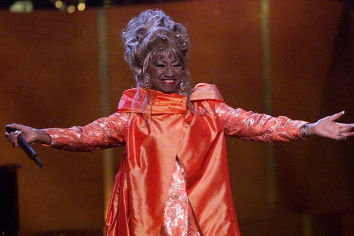 Cuban American salsa singer Celia Cruz onstage performing at <em>VH1 Divas Live: The One and Only Aretha Franklin</em> in New York City in 2001. Cruz is being honored on the U.S. quarter in 2024.
