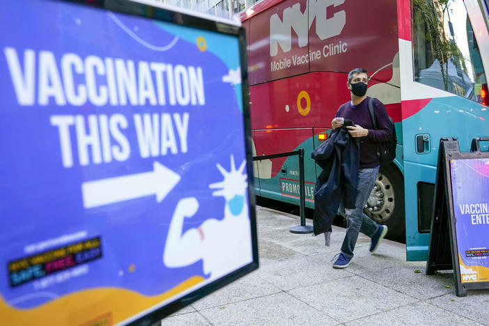 A man walks out of a vaccination bus at a mobile vaccine clinic in Midtown Manhattan, Dec. 6, 2021. New York City is ending its COVID-19 vaccination mandate for municipal employees, Mayor Eric Adams announced Monday, Feb. 6, 2023. The vaccine mandate, which led to the firing of hundreds of city workers who declined to get the shots, will end on Friday, Adams said in a news release.