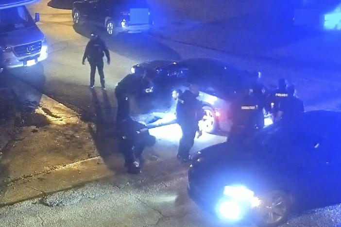 In this image from video released and partially redacted by the city of Memphis, Tenn., on Jan. 27, 2023, Tyre Nichols leans against a car after a brutal attack by five Memphis Police officers on Jan. 7, in Memphis.