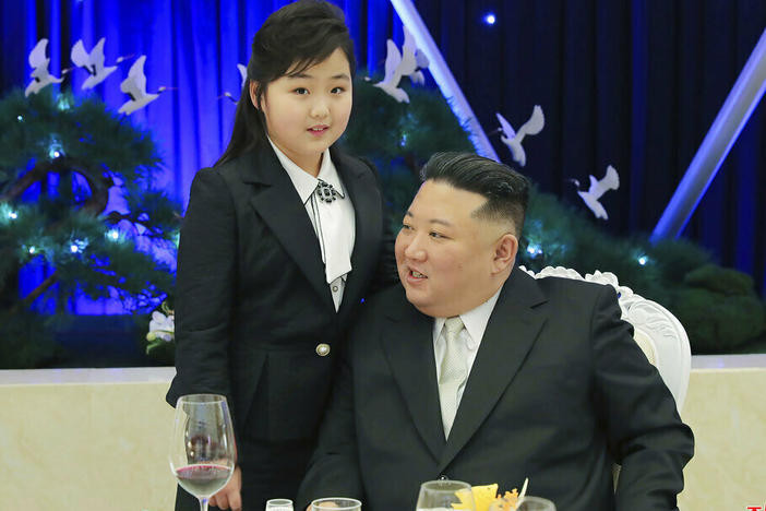 North Korean leader Kim Jong Un and his daughter attend a feast to mark the 75th founding anniversary of the Korean People's Army.