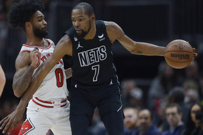 The Brooklyn Nets' Kevin Durant (right) looks to drive against the Chicago Bulls' Coby White during a Jan. 4 game in Chicago.