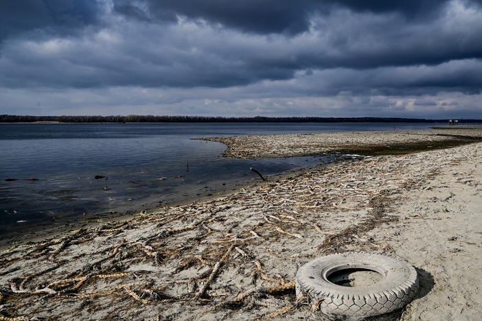 Dropping water levels in the Zaporizhzhia region of Ukraine have exposed fishing nets and roots of aquatic plants along the shoreline of the Dnipro river.