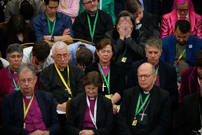Members of the Church of England General Synod pray ahead of a vote that ultimately approved blessings for same-sex couples in London on Thursday.