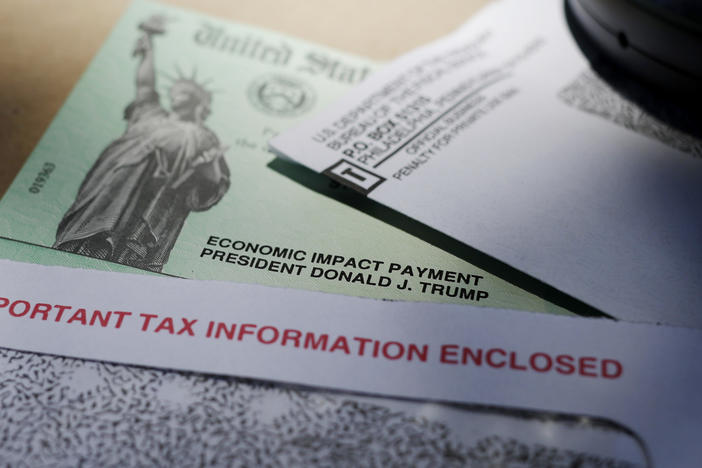 In this file photo from April 23, 2020, former President Donald Trump's name is seen on a stimulus check issued by the IRS to help combat the adverse economic effects of the COVID-19 outbreak. The IRS announced Friday, Feb. 10, 2023, that most relief checks issued by states last year aren't subject to federal taxes, providing 11th hour guidance as tax returns start to pour in.