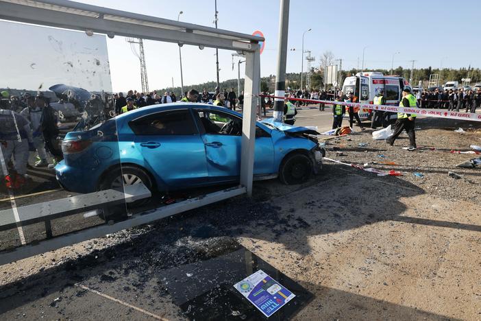 Israeli emergency responders gather at the scene in Jerusalem.