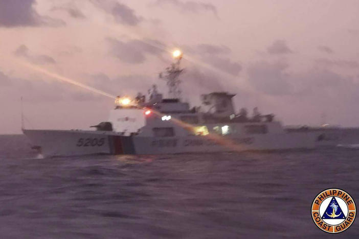 This photo provided by the Philippine Coast Guard shows a Chinese coast guard ship in the disputed South China Sea, Feb. 6, 2023.