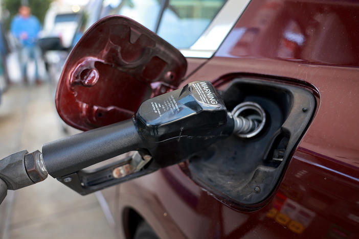 Gas is pumped into a vehicle at a gas station in Miami on Jan. 23, 2023. A rise in gas prices caused inflation to increase in January when compared to December. Gas prices remain volatile, making the outlook for inflation more uncertain.