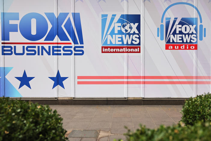 Fox News and its parent company are being sued for defamation over false claims of election fraud following the 2020 election. Above, logos for Fox News Media's growing portfolio of brands adorn its corporate headquarters in New York City.