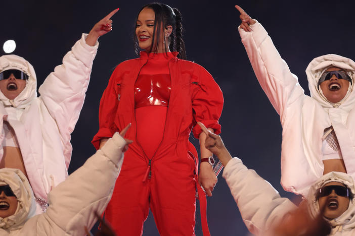 Rihanna performs onstage during the Super Bowl halftime show on Sunday night. Her performance doubled as a pregnancy reveal.