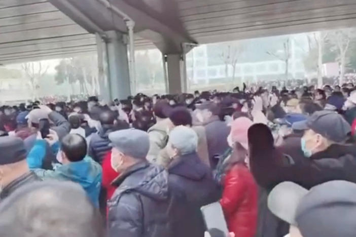 Demonstrators gather outside Zhongshan Park in Wuhan, China, to protest changes to medical benefits, on Wednesday, in this still image from social media video obtained by Reuters.