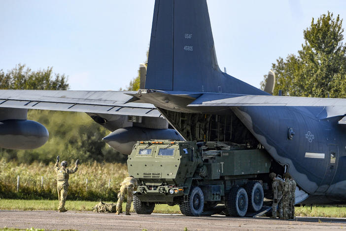 Soldiers unload a High-Mobility Artillery Rocket System (HIMARS) in Riga, Latvia, on Sept. 26, 2022. The U.S. provided Ukrainian forces with 38 HIMARS in 2022.