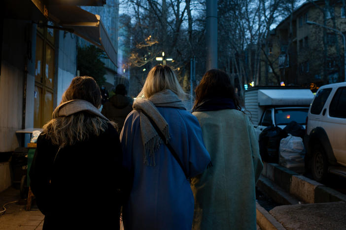 Women without headscarves stroll through Tehran's Tajrish Square in February 2023.