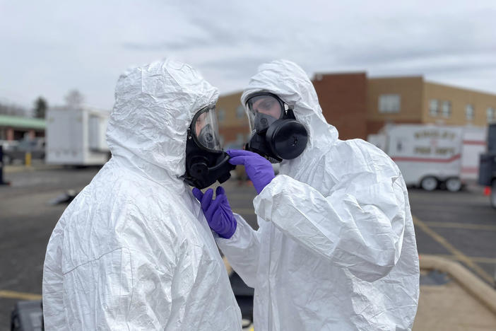 In this photo provided by the Ohio National Guard, ONG 52nd Civil Support Team members prepare to enter an incident area to assess remaining hazards in East Palestine, Ohio, on Feb. 7.