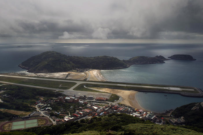 A view from the 220-meter (670 feet) summit of Mt. Bi looks down on the airport's single runway jutting out into into the sea on Beigan in the Matsu island group, off northern Taiwan, Aug. 22, 2012.
