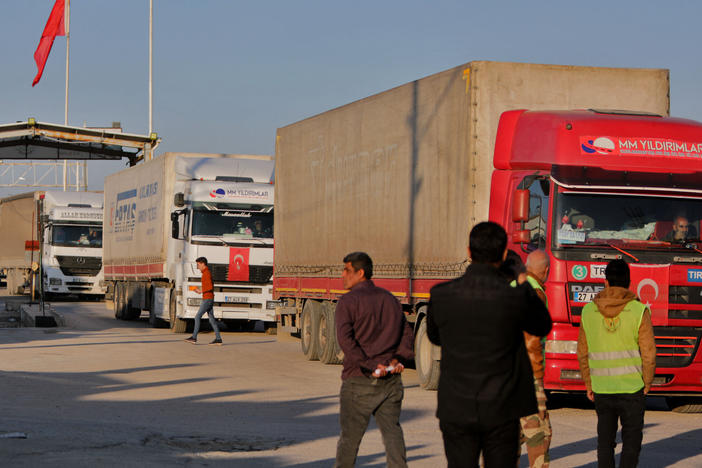Trucks in an aid convoy cross from Turkey into rebel-held northern Syria through the Bab al-Salama crossing on Feb. 14, after it reopened for U.N. relief.