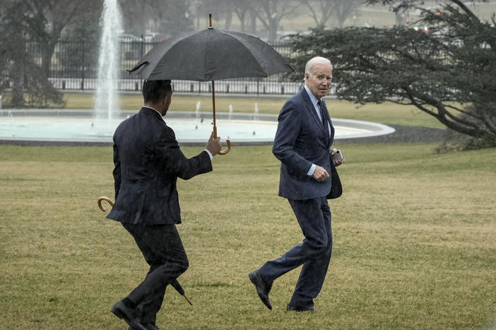 President Biden jogs across the South Lawn of the White House in the rain after getting his latest physical on Feb. 16.