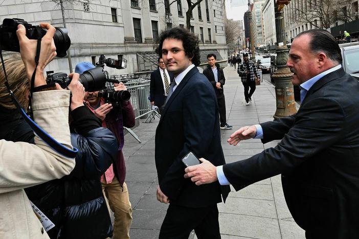 FTX founder Sam Bankman-Fried arrives at the U.S. Federal Court in New York for a hearing on Feb. 16, 2023. As he awaits trial, the disgraced former CEO is defending himself in the court of public opinion.