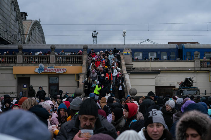 Displaced people from eastern Ukraine spill out of a train station in Lviv, in western Ukraine, last March. At this point, more than 2 million people had fled the country as a result of Russia's invasion.