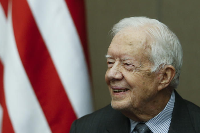 Former President Jimmy Carter smiles as he is awarded the Order of Manuel Amador Guerrero by Panamanian President Juan Carlos Varela during a ceremony at the Carter Center, Jan. 14, 2016, in Atlanta.