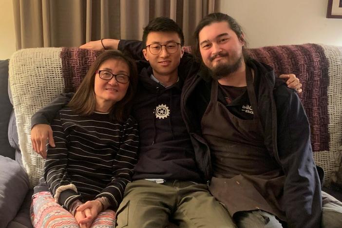 Director Bing Liu (center) with his mother and half-brother.