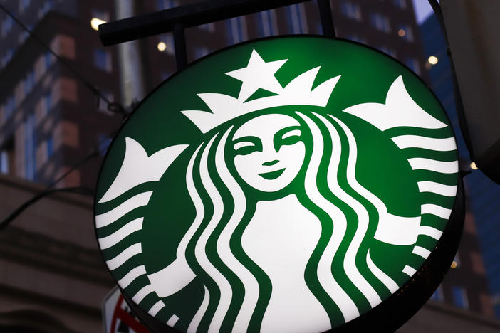 This June 26, 2019, photo shows a Starbucks sign outside a Starbucks coffee shop in downtown Pittsburgh.