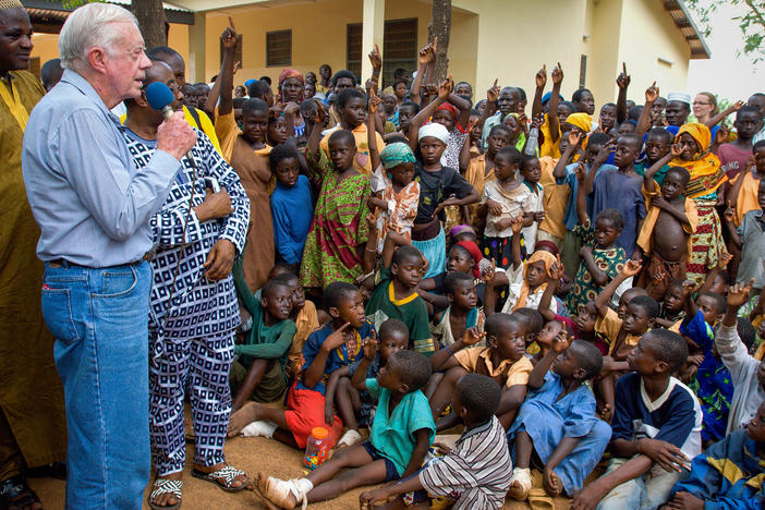 On a 2007 visit to Savelugu Hospital in Ghana, President Jimmy Carter asks a group of children if they've had Guinea worm. A raised hand is a yes.