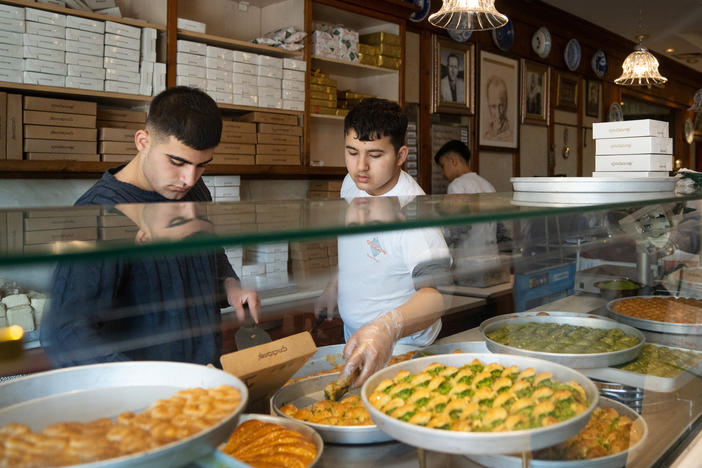 Employees box up baklava for customers at Imam Cagdas in Gaziantep, Turkey.