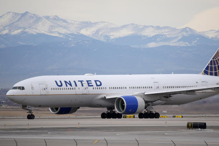 A United Airlines jetliner taxis to a runway for take off from Denver International Airport, Dec. 27, 2022.