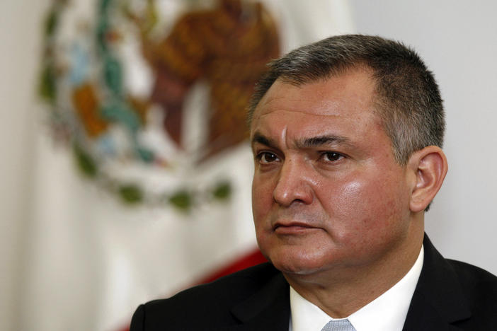 Mexico's Secretary of Public Safety Genaro García Luna attends a news conference on the sidelines of an American Police Community meeting in Mexico City, Oct. 8, 2010. The former Mexican presidential cabinet member was convicted in the U.S. on Tuesday of taking massive bribes to protect the violent drug cartels he was tasked with combating.
