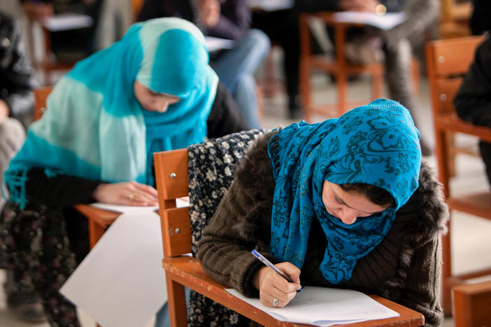 In December, the Taliban banned female students from attending university. Some of them are turning to online options. Above: Afghan female students attend Kabul University in 2010.