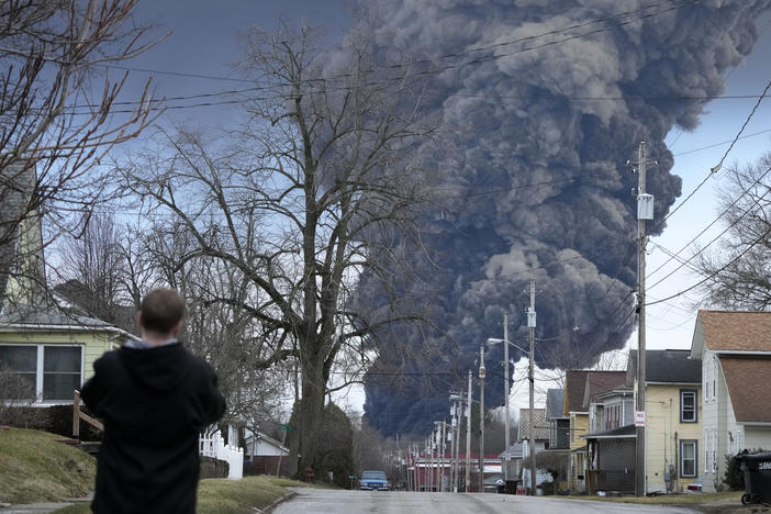 A black plume rises over East Palestine, Ohio, as a result of a controlled detonation on Feb. 6 of a portion of the derailed Norfolk Southern trains.