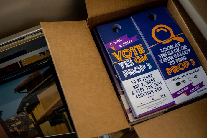 Proposal 3 flyers are situated in boxes on Nov. 6, 2022, in Dearborn, Mich. Voters in Michigan passed Prop 3, enshrining the right to abortion in the state constitution.